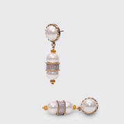 A pair of gold and white pearl drop earrings with silver rhinestone accents, displayed on a light gray background.