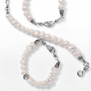 Two pearl bracelets with silver-toned clasp details, arranged on a clean white background.