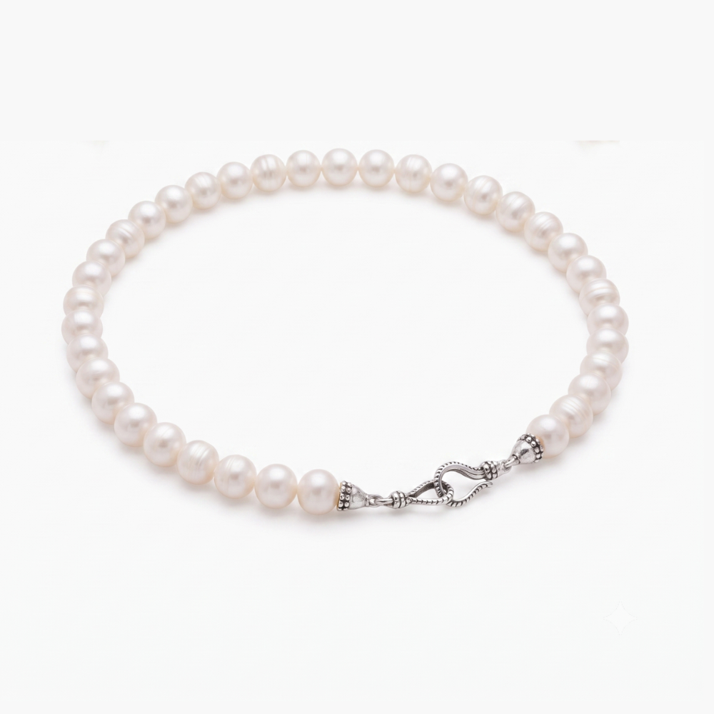 A strand of white freshwater pearls arranged in a circle with a silver-toned twisted rope clasp, shown on a clean white background.