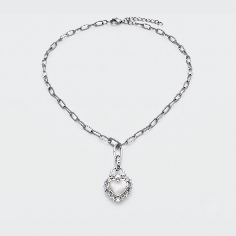 A silver-toned chain necklace with a heart-shaped pendant, displayed on a clean white background.