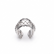 A sterling silver adjustable ring with a textured, basketweave-like top and beaded edges, shown on a clean white background.